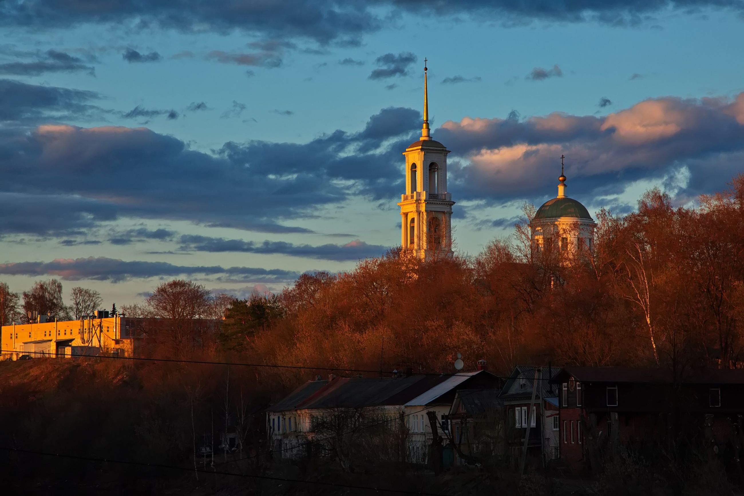 На закате.